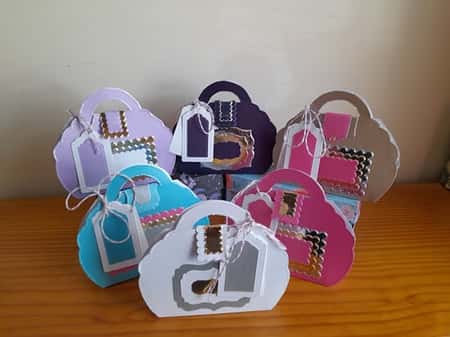 These lovely handmade handbag gift boxes with velcro fastening and matching gift tags.
