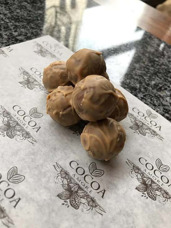 Mark the beginning of May with our handmade caramel mousse truffles!