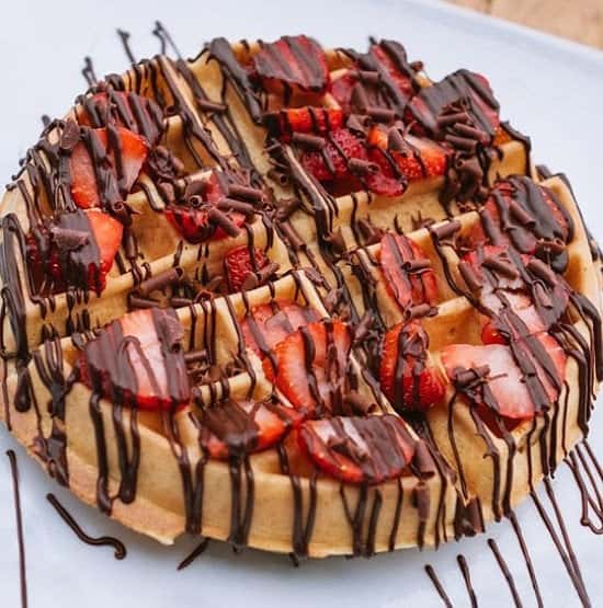 How about a golden waffle with some fresh strawberries drizzled with milk chocolate today?!