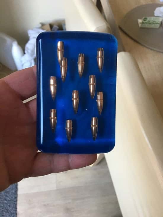 Nato military Nato 7.62 bullet tips set in a resin paperweight.
