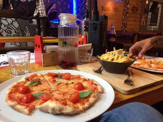 Our weekend meal deal is the best in town - Only £6.95 for a 9" stone baked pizza, side and drink..