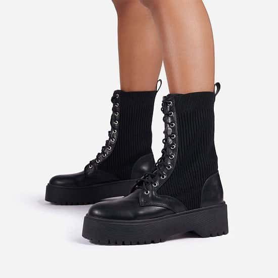 Save on these Soulmate Ribbed Lace Up Ankle Biker Boot In Black Faux Leather