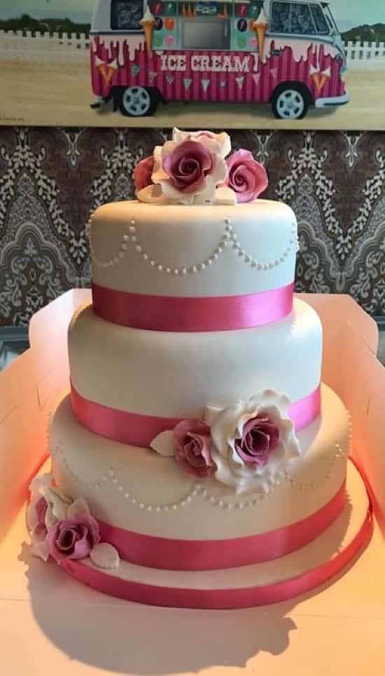 Pink theme wedding cake! All flowers are hand made.