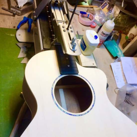 Nottingham City Guitars Fretting a custom built acoustic before the neck is carved.