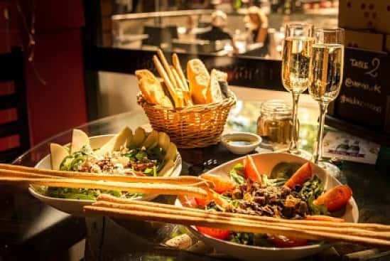 Enjoy a Complimentary Prosecco, Wine or Beer when you grab a bite to eat, Mon - Fri, 12pm - 4pm.