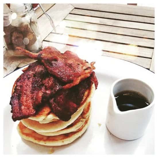 Crispy Smoked Streaky Bacon is irresistible with pancakes + maple! Join us for a celebratory brunch!