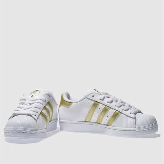 Save 49% on these Adidas white & gold superstar youth trainers