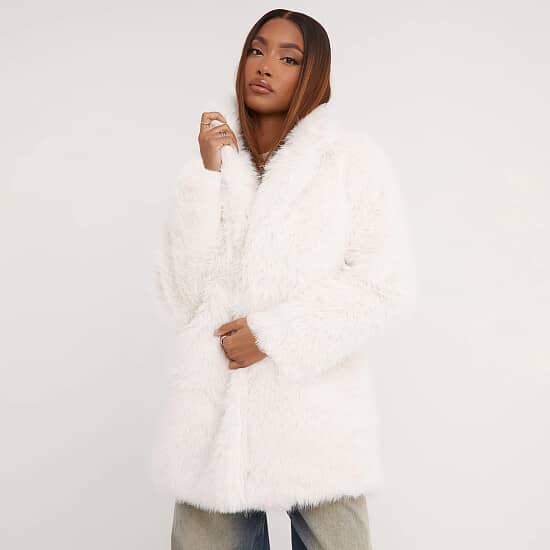 Stay warm in style with a fabulous 35% discount on the Oversized Coat in Faux Fur Cream!